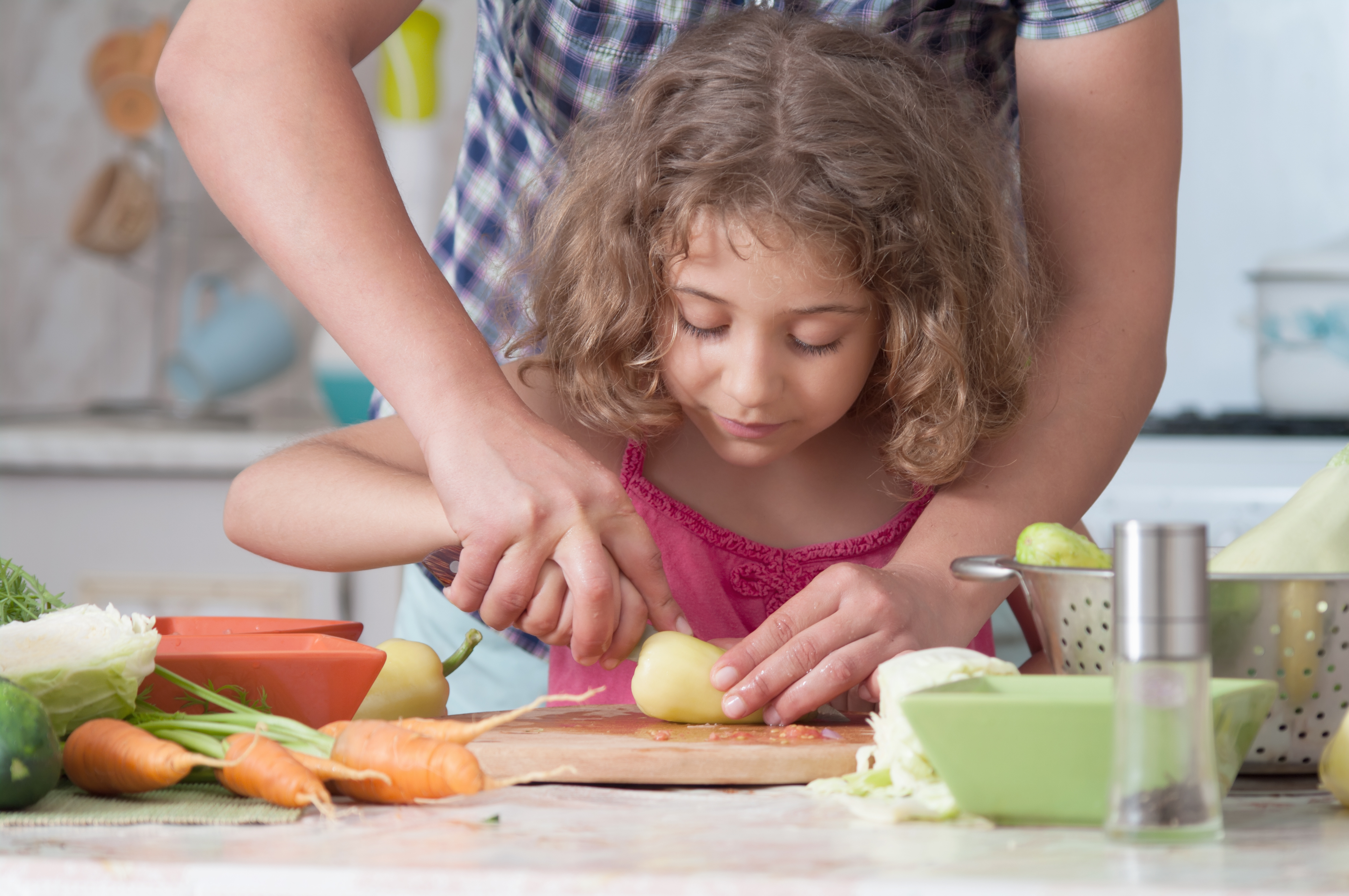 Child Learning Vegetarian Recipes with Mom